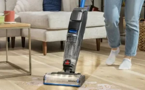 A Person using a Bissell CrossWave OmniFind Multi Surface Floor Cleaner